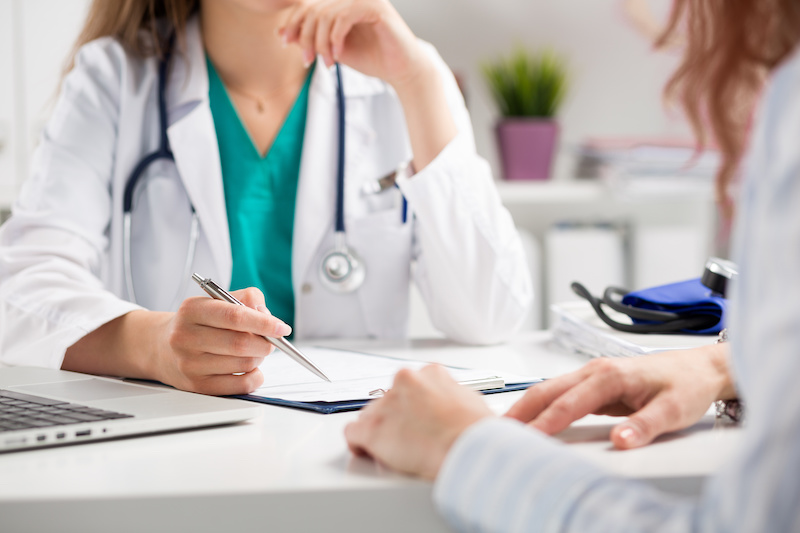 Abnormal Pap Smear; Doctor consulting patient hands closeup. Patient sitting at doctor office. Diagnostic, prevention of women diseases, healthcare, medical service, consultation or education, healthy lifestyle concept