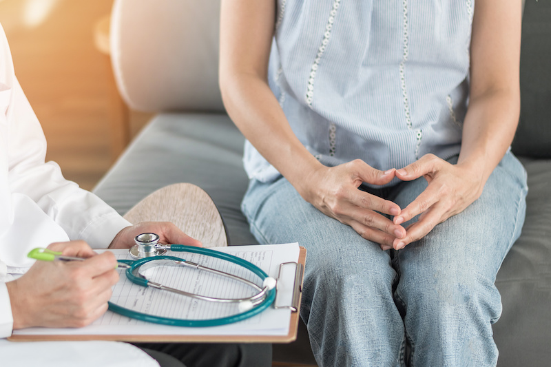 Doctor or psychiatrist consulting and diagnostic examining stressful woman patient on obstetric - gynecological female illness, or mental health in medical clinic or hospital healthcare service center; Blog: The Annual Exam: 8 Things to Share with Your OB/GYN
