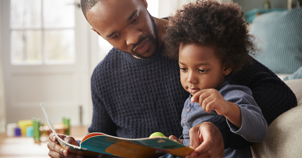Father And Young Son Reading Book Together At Home: blog: 11 Ways to Encourage a Love of Reading